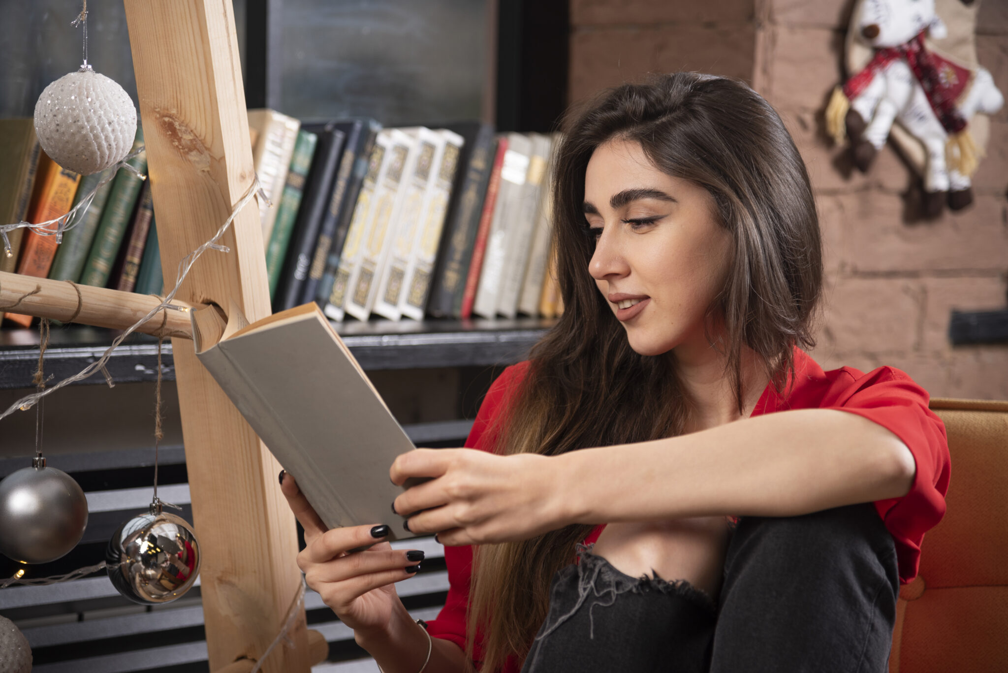 young woman model sitting reading book scaled