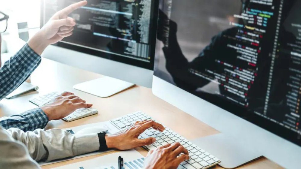Build a Strong Digital Foundation with Website Development by LeoTech Online 4 working on computer.jpeg 1 4